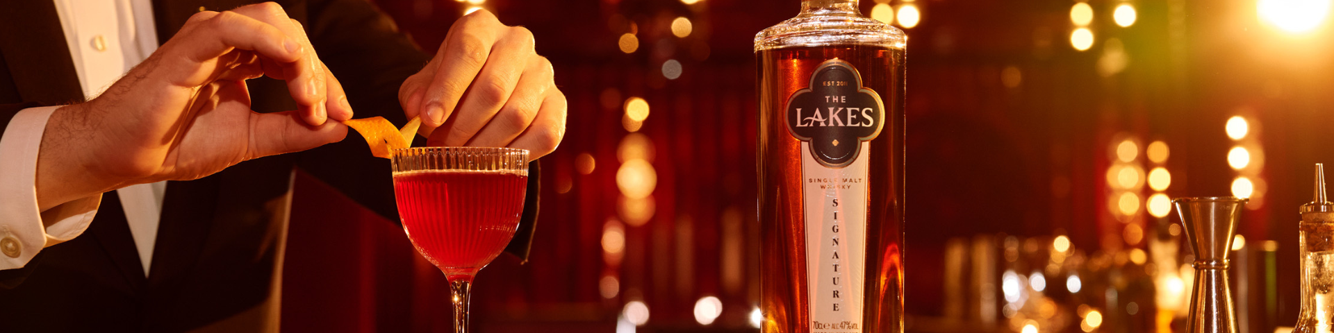 whisky cocktail made with signature single malt whisky from lakes distillery, with orange garnish